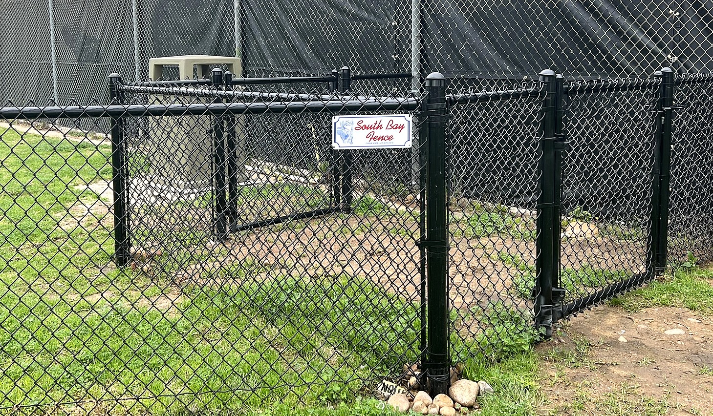 Black chain link dog park fence