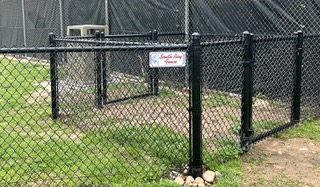 Black chain link dog park fence