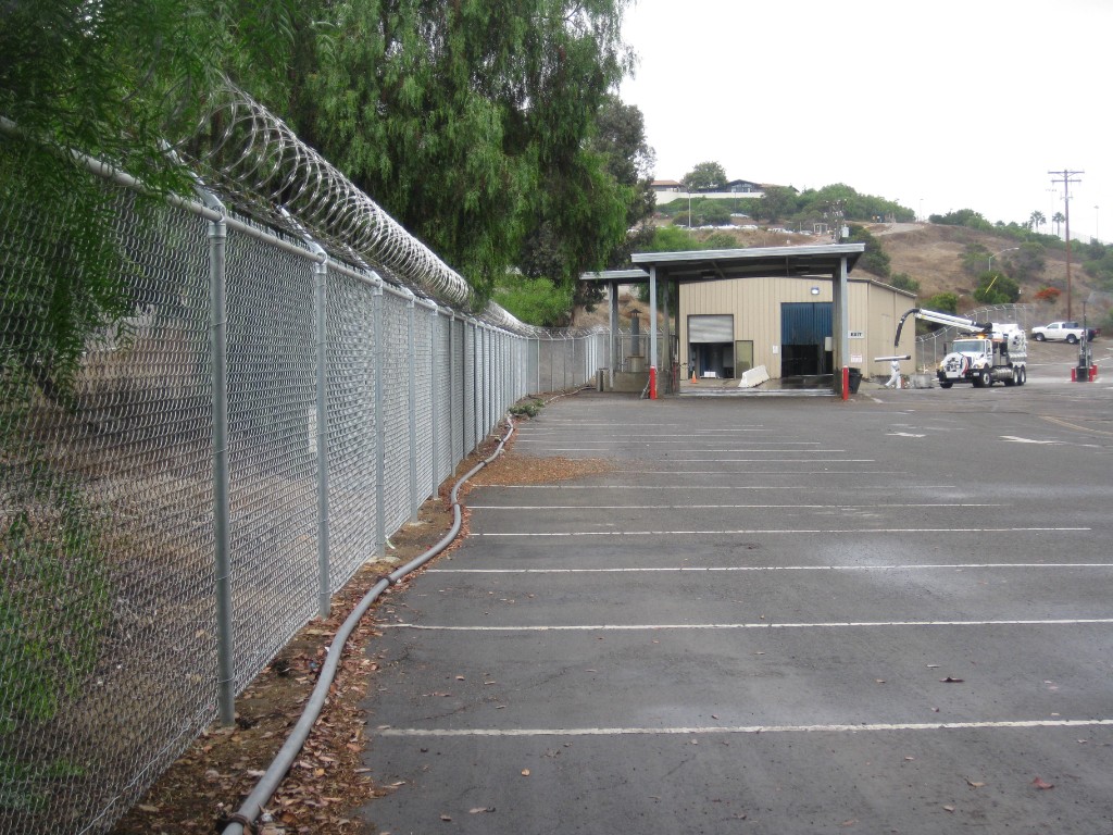 Chain link perimeter fence with razor wire