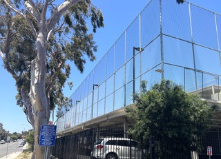 Chain link fence on second story structure