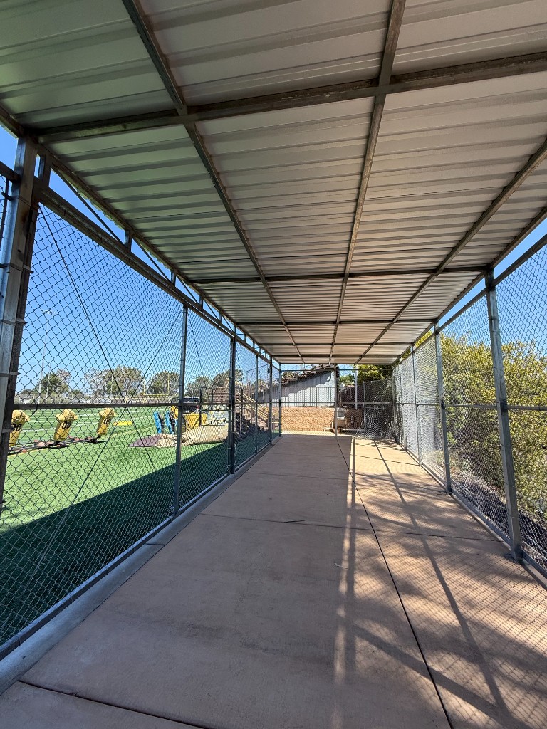 Covered chain link walkway enclosure