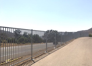 Commercial iron fence along road