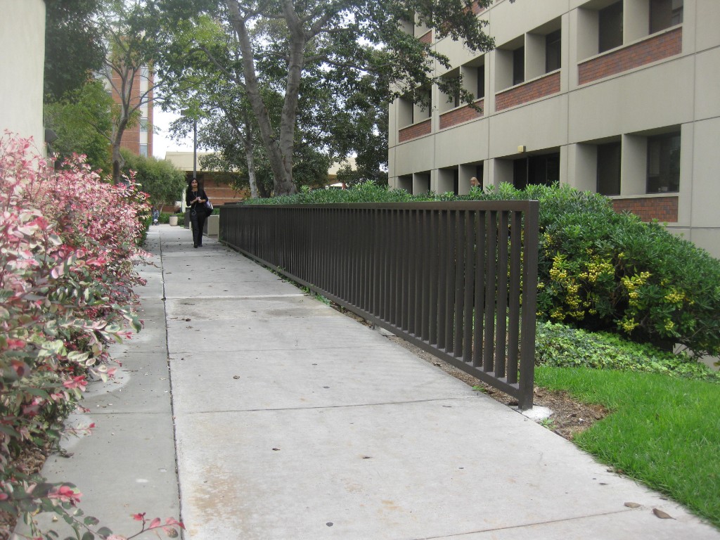 Commercial iron fence along walkway