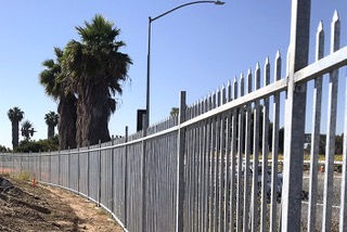 Curved iron picket fence