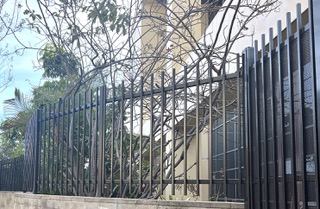 Iron fence on block wall