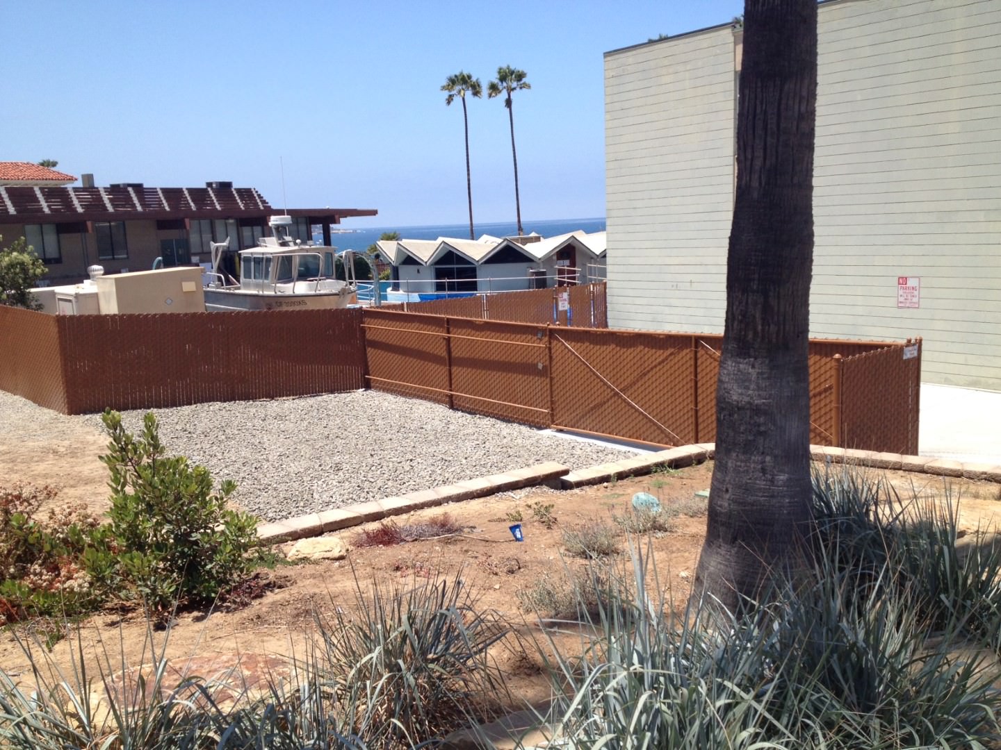 Brown privacy chain link fence with slats