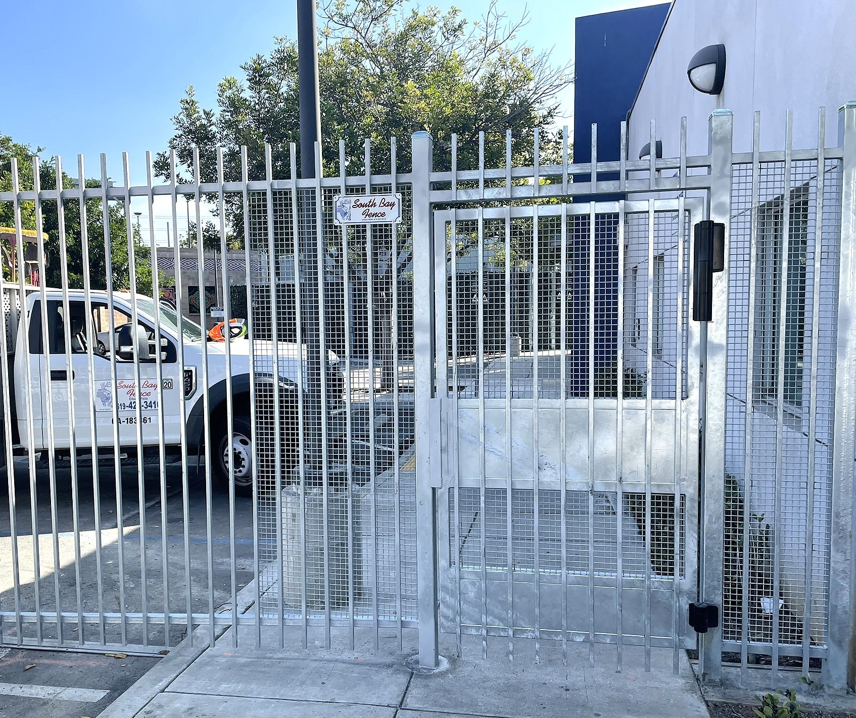 Security iron gate with tamper resistant mesh