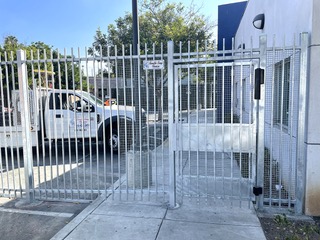 Security iron gate with tamper resistant mesh