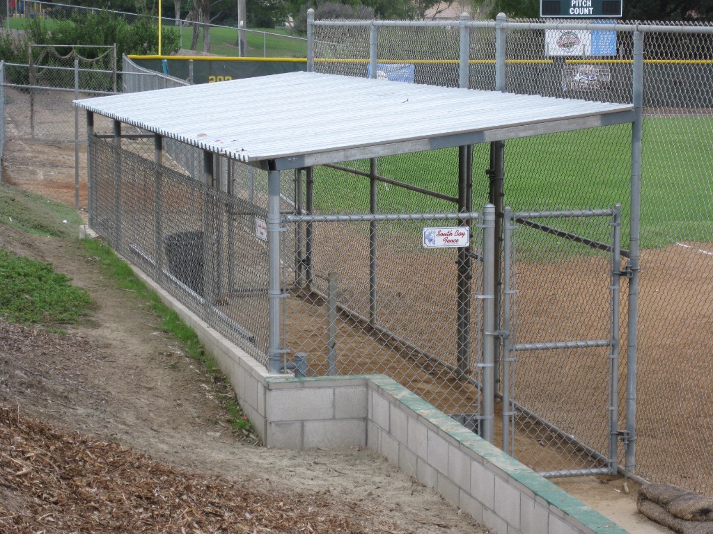 Covered dugout with chain link fence