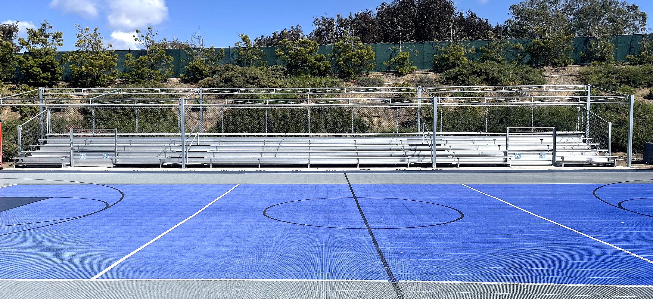 Tennis court bleachers and shade structure